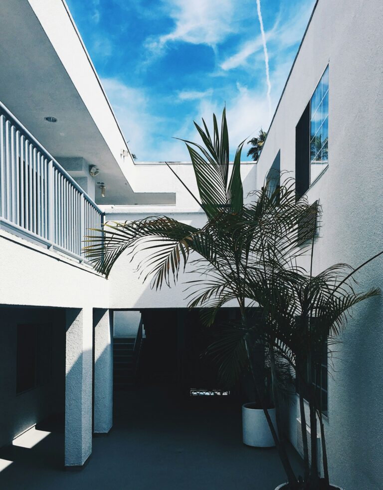 White stucco apartment building walkway in Southern California